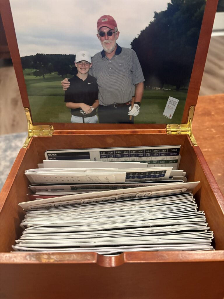 box of scorecards from rounds with Logan and his grandfather